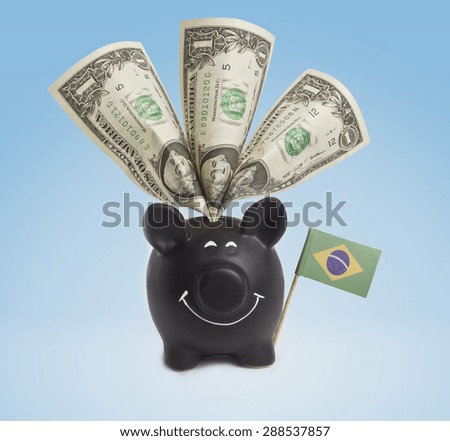 One dollar banknote in a smiling piggybank of Brazil.(series)