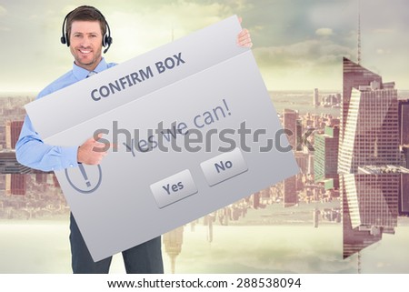 Businessman showing card wearing headset against confirm box