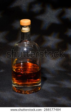 Whisky bottle with stars in the sky