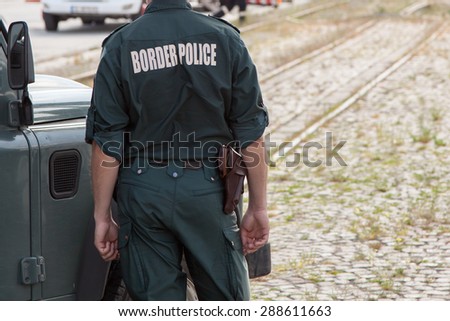 Closeup of a border police officer Royalty-Free Stock Photo #288611663
