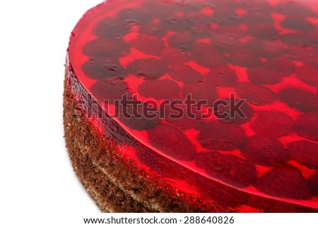 Cream cake with raspberries on white background