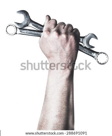 Mechanic hand hold spanner tool in hand Royalty-Free Stock Photo #288691091