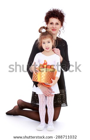 Portrait of a beautiful young mother and little daughter holding gift box-Isolated on white background