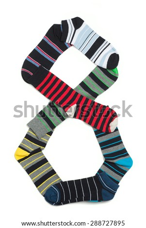 Many pairs of socks forming number eight. Socks with different colours on white background.