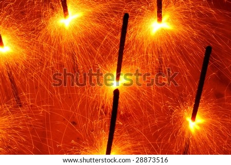 Yellow sparklers at night