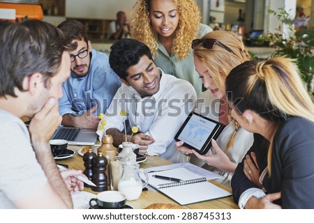 Small Business team meeting global sharing economy tablet touchscreen cafe Royalty-Free Stock Photo #288745313