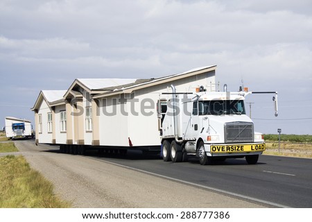 Transporting portable homes - New Mexico. Royalty-Free Stock Photo #288777386