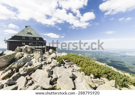 Shelter on the top of Szrenica mount in Karkonosze mountains, close to the Szklarska Poreba city Royalty-Free Stock Photo #288795920