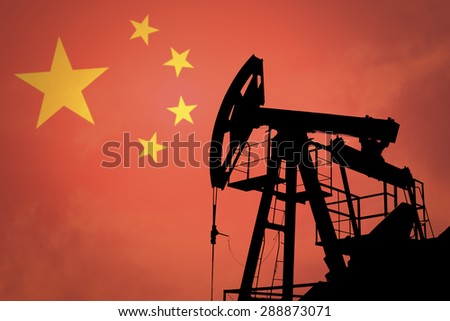 Oil pump on background of flag of China