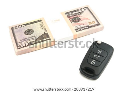 fifty dollars banknotes and car keys on white