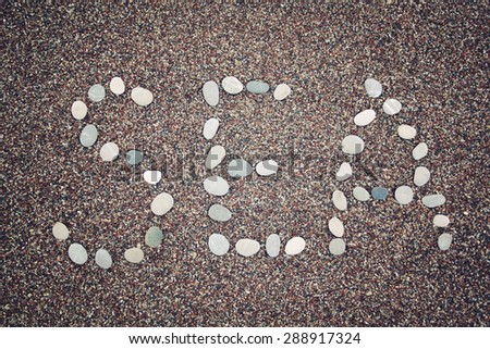 'Sea' word written with pebbles on the sand. Aged photo. 'Sea' word made by small stones on the beach. Word on the sand - toned photo. Antalya Province, Turkey. Wide photo for site slider.