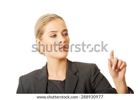Businesswoman pressing an abstract button.