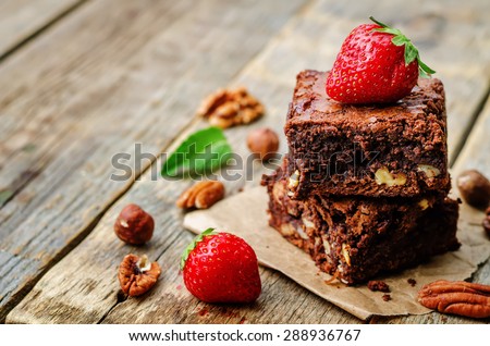 chocolate nut brownie cake decorated with strawberries. the toning. selective focus Royalty-Free Stock Photo #288936767