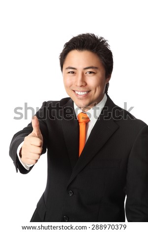 Attractive businessman in his 20s wearing a black striped suit with an orange tie. White background.