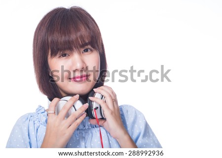 Music,Young woman holding headphones with white background