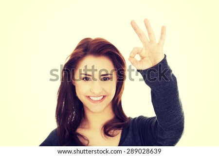 Happy smiling woman with perfect hand sign