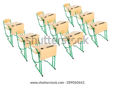 School wooden desks and chairs isolated on white