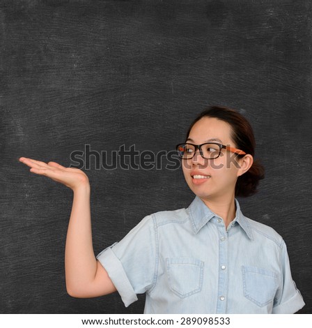 Asian woman show sign on chalkboard