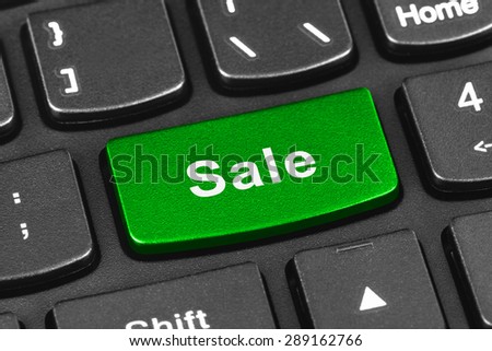 Computer notebook keyboard with Sale key - technology background