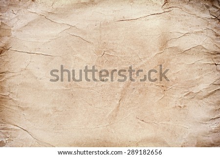 Old grungy stained paper background or texture, space for text.