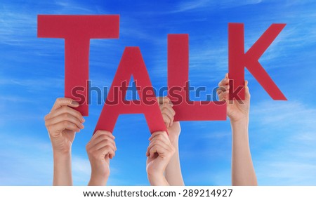 Many Caucasian People And Hands Holding Red Letters Or Characters Building The English Word Talk On Blue Sky