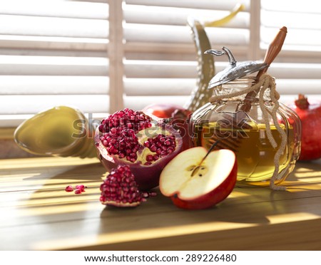 Honey jar with apples and pomegranate for Jewish New Year Holiday rosh hashanah