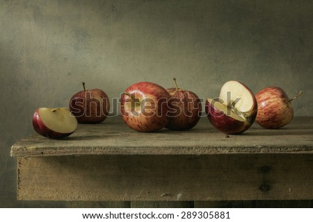 Still life photography with apples on wood table