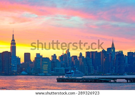 New York City, colorful sunrise with view of Manhattan buildings