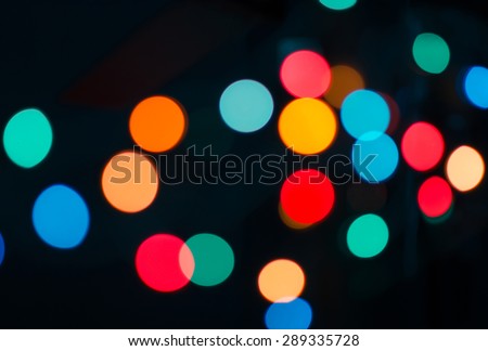 Abstract theme: colorful bokeh blurred lights on a dark background