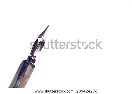 Vintage penholder .Old and used writing pen with ink metal head. Drawing Pen isolated on white with copy space Royalty-Free Stock Photo #289424276