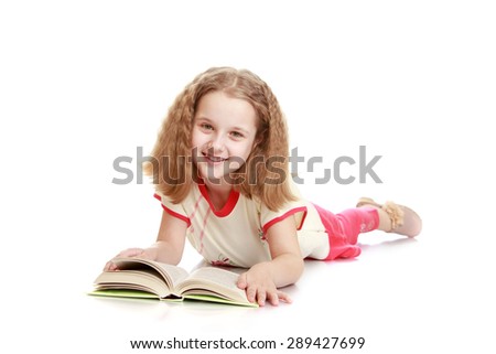 Blonde teen girl lies on the floor and reading a book-Isolated on white background