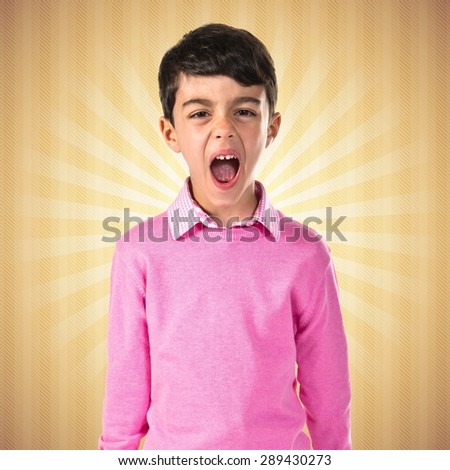 Child shouting over pop background