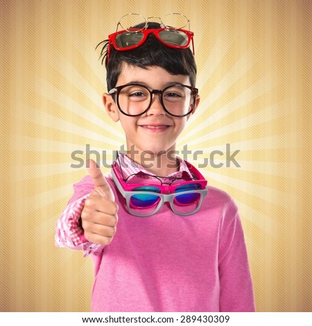 Happy boy with many glasses