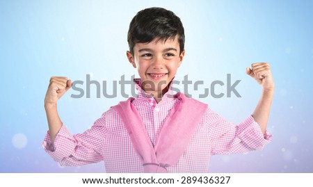 Lucky boy over blue background