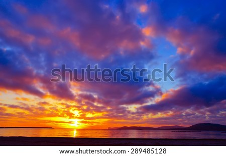 colorful sky over Alghero at sunset, Sardinia Royalty-Free Stock Photo #289485128
