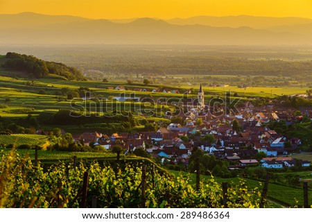 Beautiful scenic mountain panorama with vineyards and old picturesque town in Germany at sunset, Black forest, Kaiserstuhl, Oberrotweil.Travel and wine-making background.