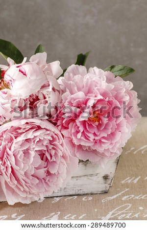 Wooden box with pink peonies
