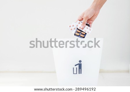 hand throwing pills away. Health concept Royalty-Free Stock Photo #289496192