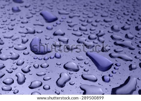 conceptual image of foot shaped water drop walking through normal water drop