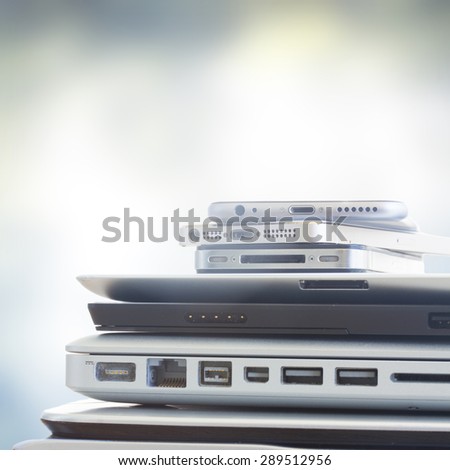 pile of electronical devices on gray bakcground  - technology concept Royalty-Free Stock Photo #289512956