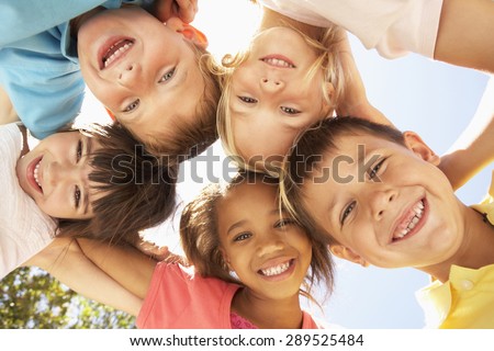 Group Of Children Looking Down Into Camera Royalty-Free Stock Photo #289525484