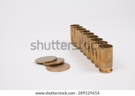 Coins thai baht stack and bullet shell on white background