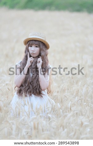 Asian girl on wheat