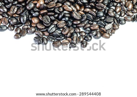 Roasted coffee beans on a white background.