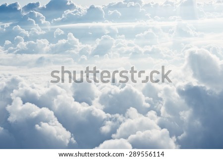 Aerial view on white fluffy clouds Royalty-Free Stock Photo #289556114