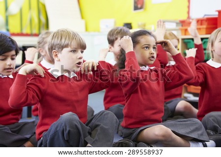 Pupils Perfoming Actions Whilst Singing Song Royalty-Free Stock Photo #289558937