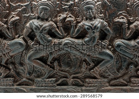 Carving candle. Detail of Hindu dancers