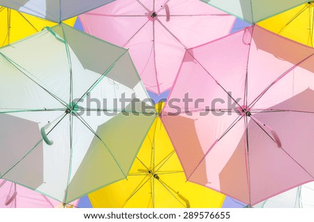 A lot of multicolored umbrellas. Color umbrellas urban decoration. 