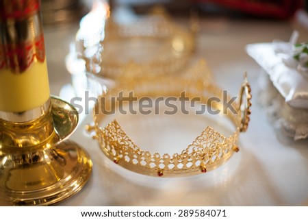 classic wedding ceremony golden crowns in the old church