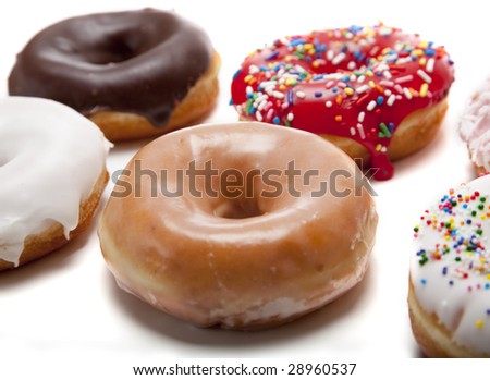 A group of fresh decorated donuts on a white background